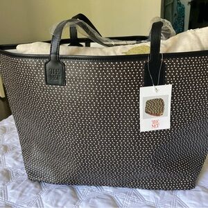 The Met canvas coated bag with leather trim.   NWT